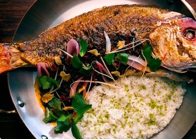 Pao by Paul Qui signature dishes Scallop Crudo
Chicken Wings
Branzino